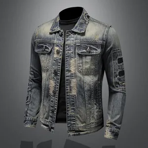 Men's vintage distressed denim jacket with heavy-duty patches and embroidery detail