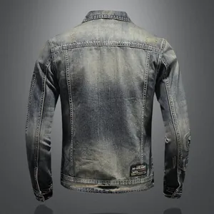 Detailed back view of a vintage distressed denim jacket for men with rugged patches