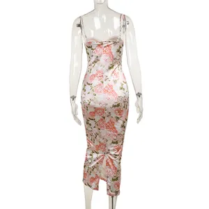 Back view of a French floral satin slip dress with a mermaid hem and slit detail.