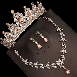 Luxury rose gold bridal jewelry set including crown and necklace with pink crystals