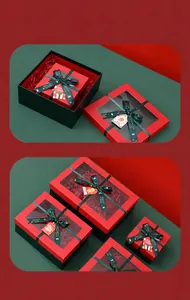 Premium red Christmas gift box featuring transparent window and festive green ribbon detail