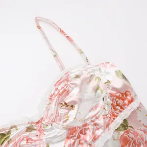 Detailed macro view of French floral satin camisole dress featuring delicate white lace trim