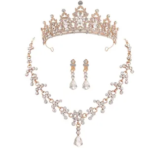 Elegant rose gold bridal jewelry set featuring crystal tiara necklace and drop earrings