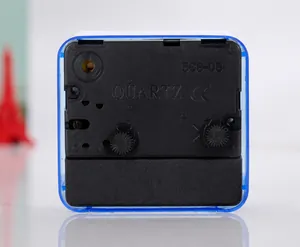 Detailed back view of a square mini alarm clock showing movement components