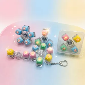 Vue détaillée d'un hand spinner en forme de patte de chat lumineuse aux couleurs macaron