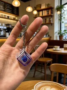 Close-up of a mechanical switch keychain with a purple transparent base in a cafe