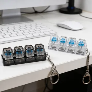 Close-up of 4-key mechanical switch fidget toy keychain with glowing LED light