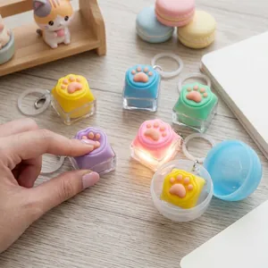Porte-clés déstressant en silicone en forme de patte de chat pour clavier mécanique
