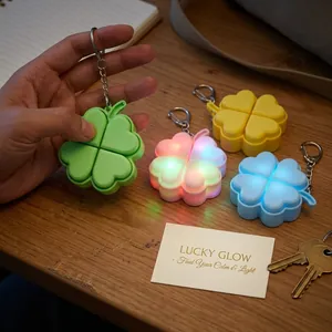 Macro detail of a glowing four-leaf clover stress-relief keychain with colorful LED light