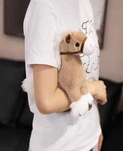 Model holding a cute simulation brown horse plush toy with white mane details