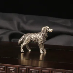 Detailed macro shot of vintage brass sheepdog figurine featuring intricate fur texture