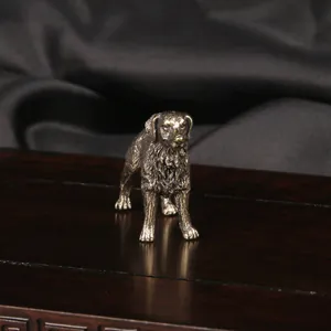 Close-up of a vintage brass shepherd dog figurine with a detailed antique bronze finish