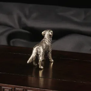 Close-up back view of a vintage brass sheepdog figurine desktop ornament for home decor