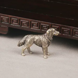 Close-up macro detail showing the intricate texture of an antique brass shepherd dog figurine