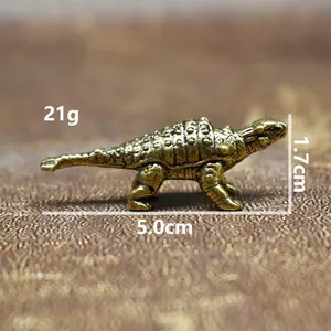 Detailed size view of a vintage brass Ankylosaurus dinosaur figurine, weighing 21g