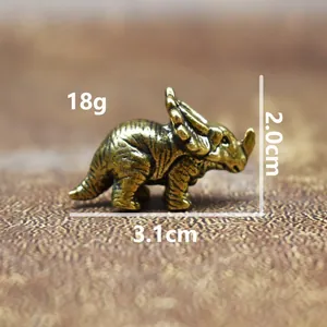 Detail view of brass triceratops dinosaur figurine with weight and size measurements