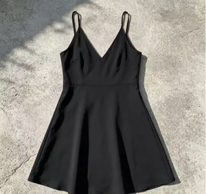 Close-up view of a black chiffon V-neck spaghetti strap dress with a flared A-line skirt