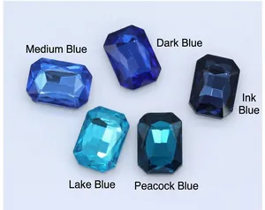 Macro detail of octagonal faceted crystal glass gems in various shades of blue