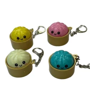 Lot de porte-clés raviolis lumineux mignons avec des visages colorés et une base