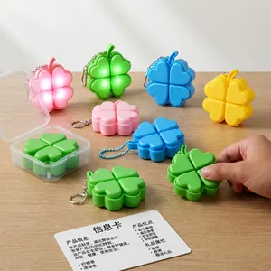 Lucky four-leaf clover fidget keychain with LED light and tactile mechanical feedback