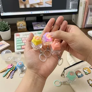 Simpatico portachiavi fidget zampa di gatto in silicone con tasto meccanico LED