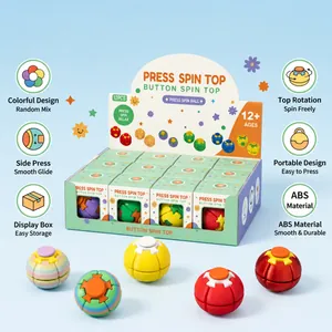 Close-up of colorful fidget spin tops and bulk packaging for stress relief toy