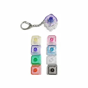 Luminous mechanical keyboard switch keychain stress relief toy in various colors