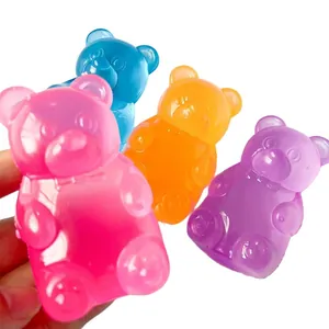 Close-up of four colorful translucent gummy bear stress relief squishy toys.