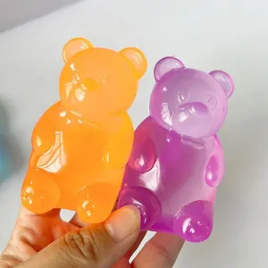 Detailed view of translucent orange and purple gummy bear squishy toys for stress relief