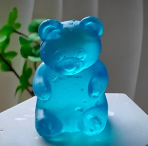 Blue translucent bear-shaped squishy stress relief toy with a cool ice-like texture
