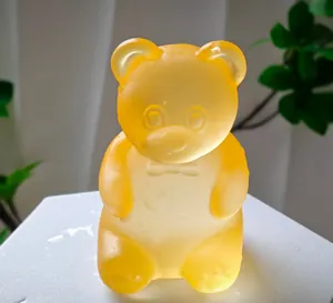 Yellow gummy bear-shaped squeeze stress relief sensory toy with translucent finish