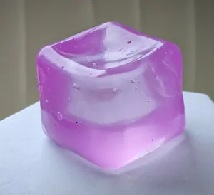 Purple cube-shaped maltose squeeze toy with a jelly-like texture for stress relief