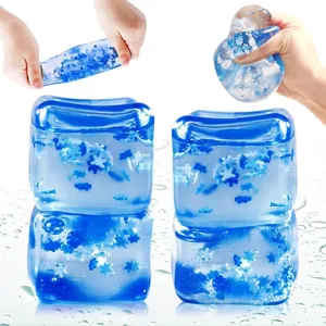 Dreamy blue ice cube squishy stress relief toy with decorative snowflake sequins inside