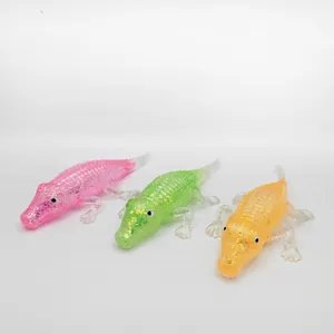 Detail view of colorful crocodile-shaped maltose squishy stress relief toys with glitter