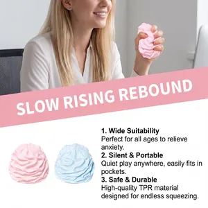 A woman squeezing a soft pink cream-shaped squishy toy in a professional office environment