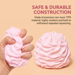 Close-up of pink cream squishy toy showing TPR material texture and squeeze flexibility.