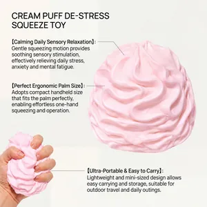 Detail view of pink cream puff squeeze toy showing its soft texture and handheld size.