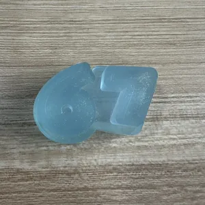 Detailed close-up of a blue '67' shaped decompression squishy toy with glitter