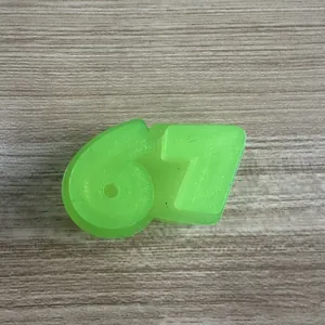Bright green 67-shaped squeeze toy made of squishy TPR material for stress relief