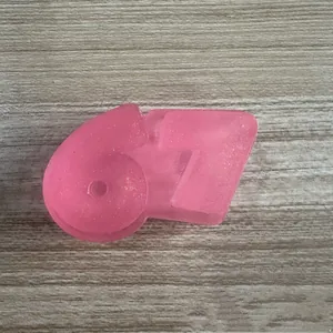 Close-up detail of the pink translucent 67-shaped squishy toy for stress relief