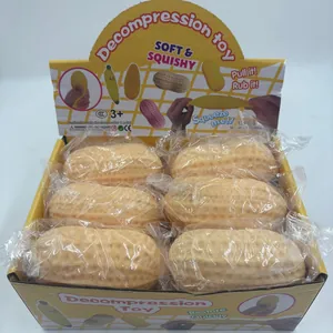 Detailed view of 6 peanut squishy decompression toys in their yellow display box packaging