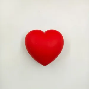 Detailed view of a soft red heart squishy toy for stress relief and slow rebound