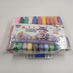Detailed view of 36 colors ultra-light clay set on a digital scale showing weight.