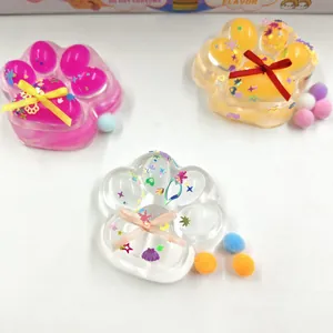 Close-up of cute cat paw maltose squishies with glitter filling and colorful ribbon bows