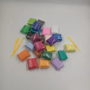 Detailed macro view of various colorful ultralight clay packets with yellow sculpting tools