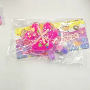 Detail view of pink cat paw squishy toy in colorful stress relief product packaging