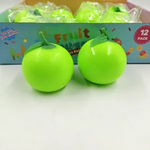 Detail showing two green apple squeeze toys with their colorful 12-pack display box.