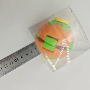 Measurement of a colorful puzzle fidget ball toy in its transparent gift box packaging