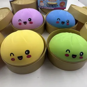 Four colorful cute baozi squishy toys in brown miniature steamers for stress relief