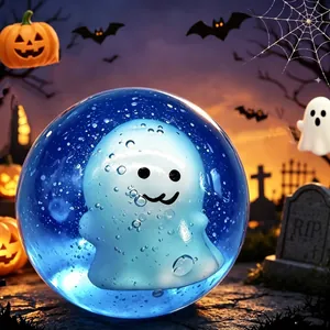 Close-up of a blue Halloween ghost squishy toy set against a spooky pumpkin background